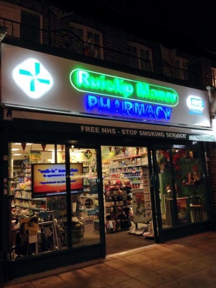 Ruislip Manor Pharmacy - shopfront at night time Ruislip Manor